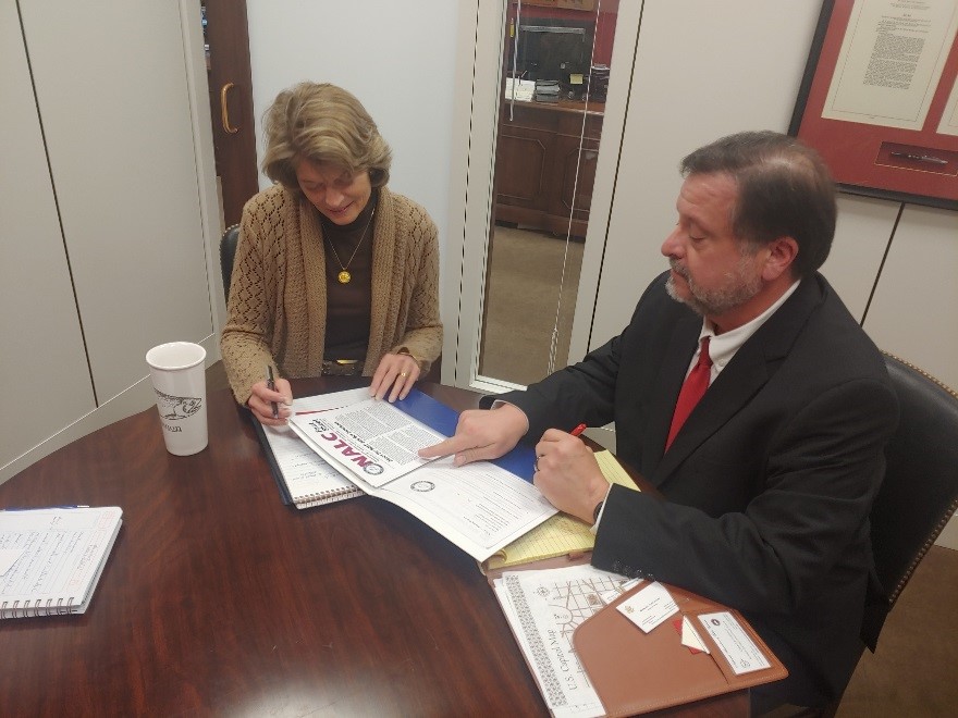 Letter carrier with Sen. Lisa Murkowski (R-AK)